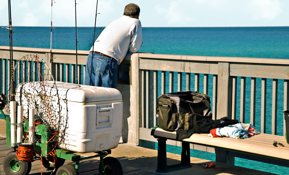 A man at a Panama City Beach fishing pier.