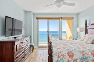 The bedroom of vacation rental to relax in after parasailing in Panama City Beach.
