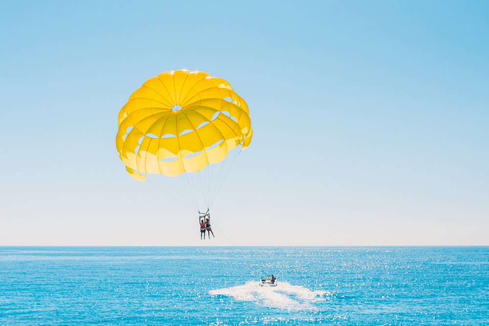 A person parasailing in Panama City Beach.