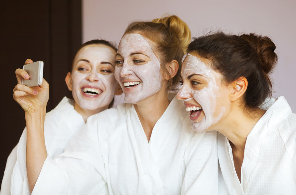 Three women getting facials during a girls' trip to Panama City Beach.