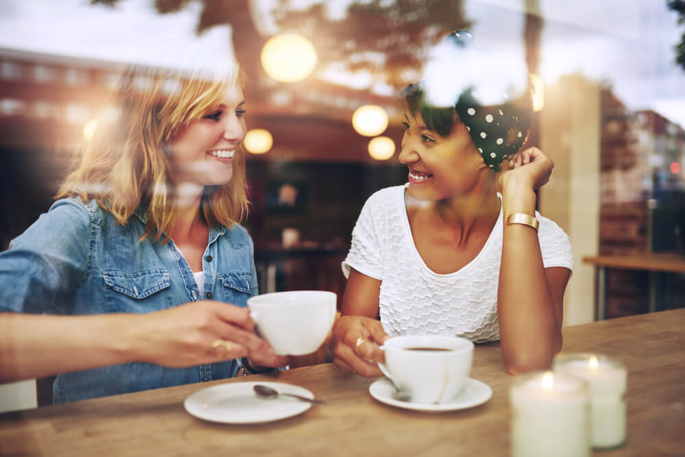 Two women at one of the best coffee shops in Panama City Beach.