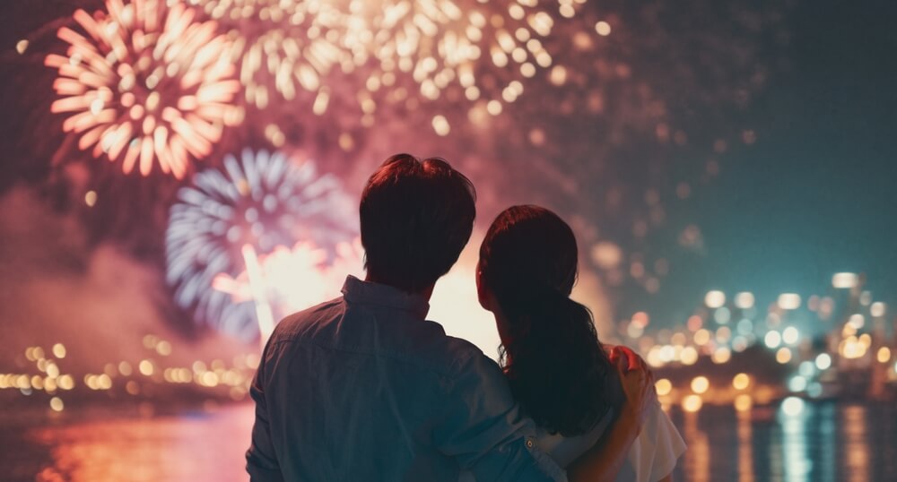 A couple watching one of the Panama City Beach 4th of July fireworks shows.