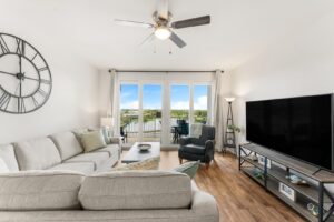 The living area of a Panama City Beach rental to relax in with ice cream from a local spot.