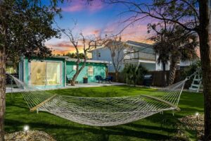 A hammock in the backyard of a rental in Panama City Beach close to unique things to do.